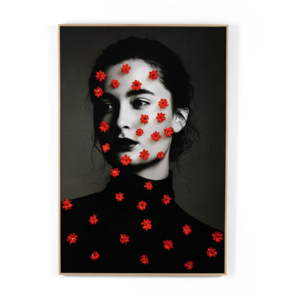 Female Portrait & Red Flowers by Getty Images